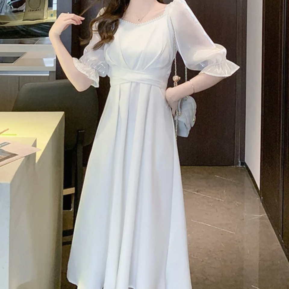A Symphony of Textures: The Diverse Fabrics in White Midi Dress Collections