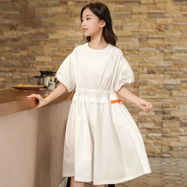 From Classic Elegance to Modern Chic: The Evolution of the White Midi Dress