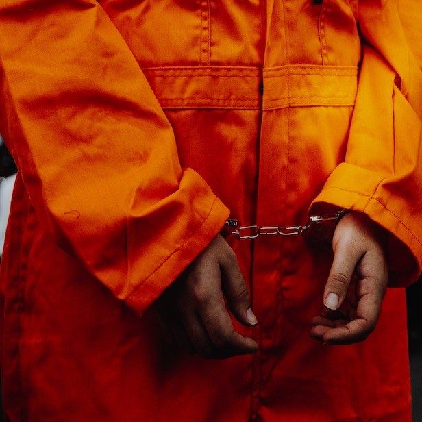 The Meaning Behind Yellow Jail Jumpsuits: