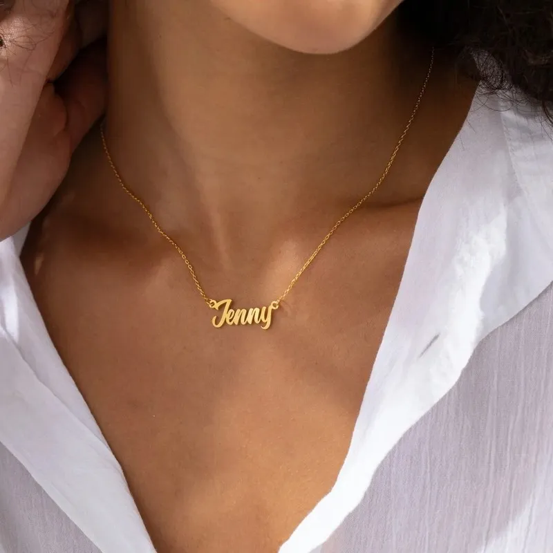 A "Jenny" necklace worn by someone in a white shirt