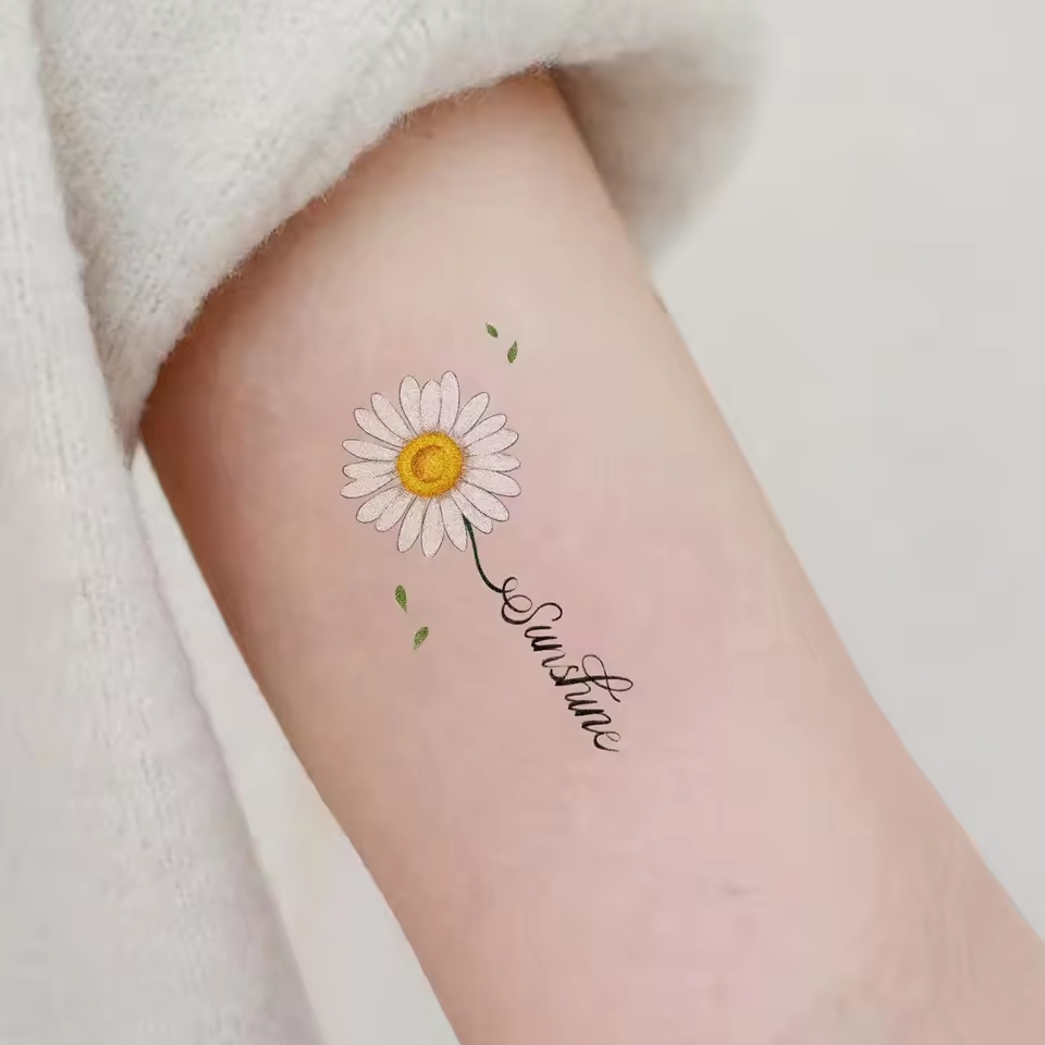Daisy tattoos carry a wealth of meaning and symbolism.